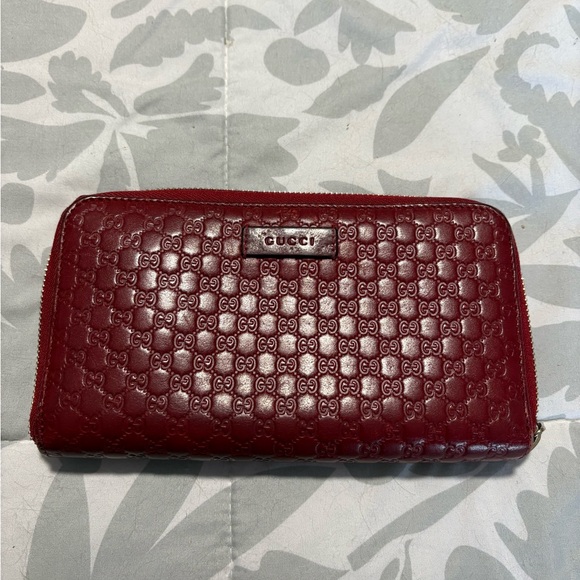 Gucci Handbags - Gucci Burgundy Embossed Leather Wallet